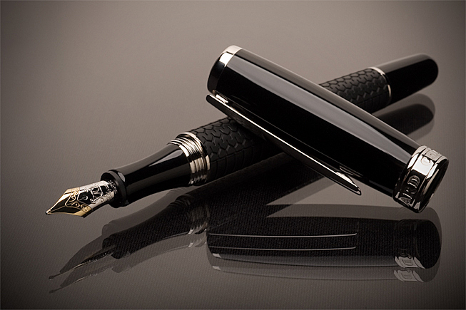 Luxury Chopard Mille Miglia fountain pen photographed with precision studio lighting and reflective surface for high-end commercial product photography.