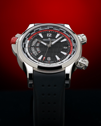 Luxury Jaeger-LeCoultre sports watch photographed with precision studio lighting against dramatic red background for high-end commercial watch photography.